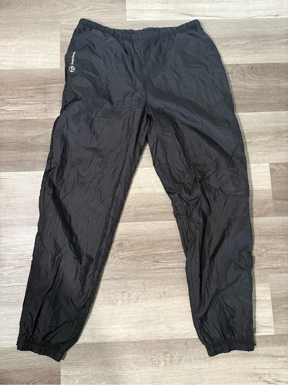 Vintage Sergio Tacchini Men's Black Track Pants with Elastic Waist and Cuffs